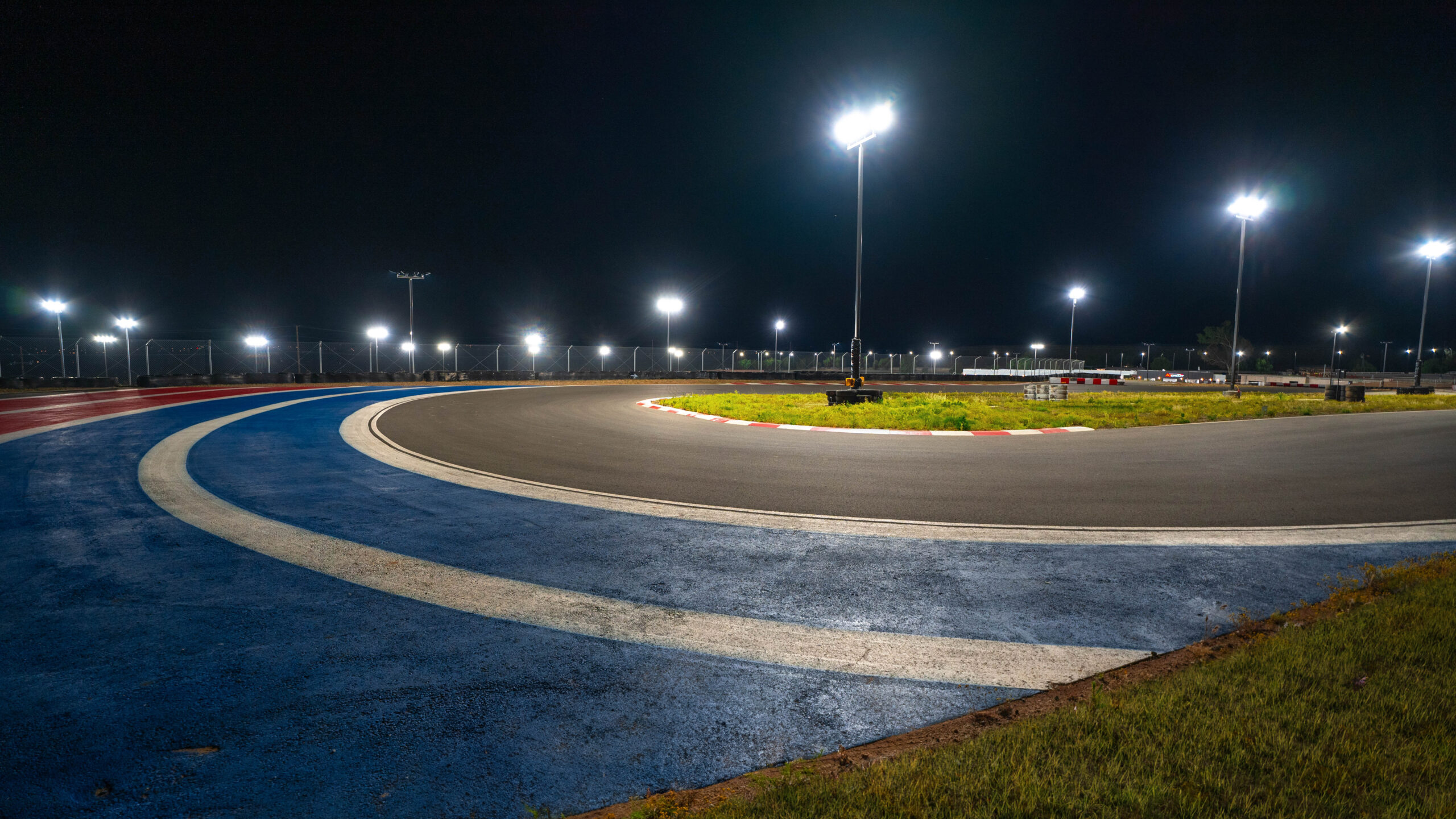 a hairpin at k1 circuit shot at night with tracklights