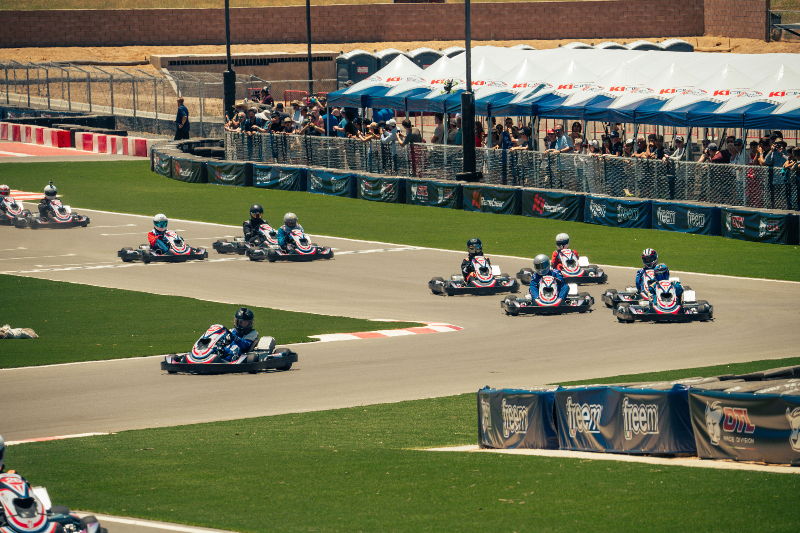 people watching karts going by at k1 circuit