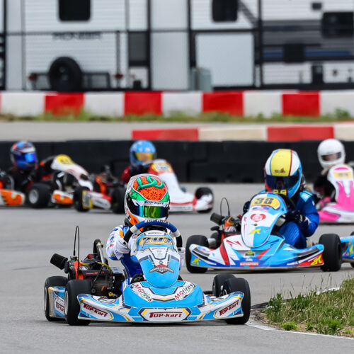 a line of karts racing at k1 circuit whiteland during an indy karting challenge event