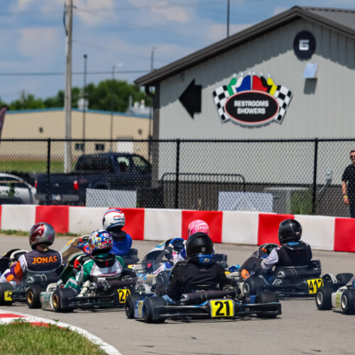 a rear shot of karts racing at k1 circuit whiteland during indy karting challenge