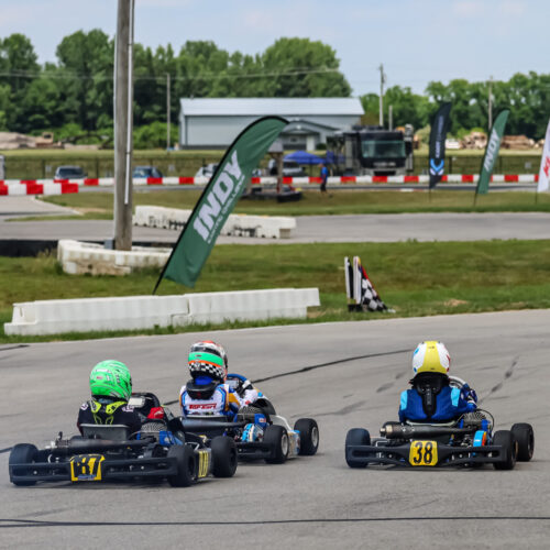 three people race karts at k1 circuit whiteland