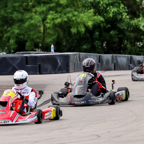 a forward shot of karts racing at k1 circuit whiteland during the indy karting challenge event in june 2025