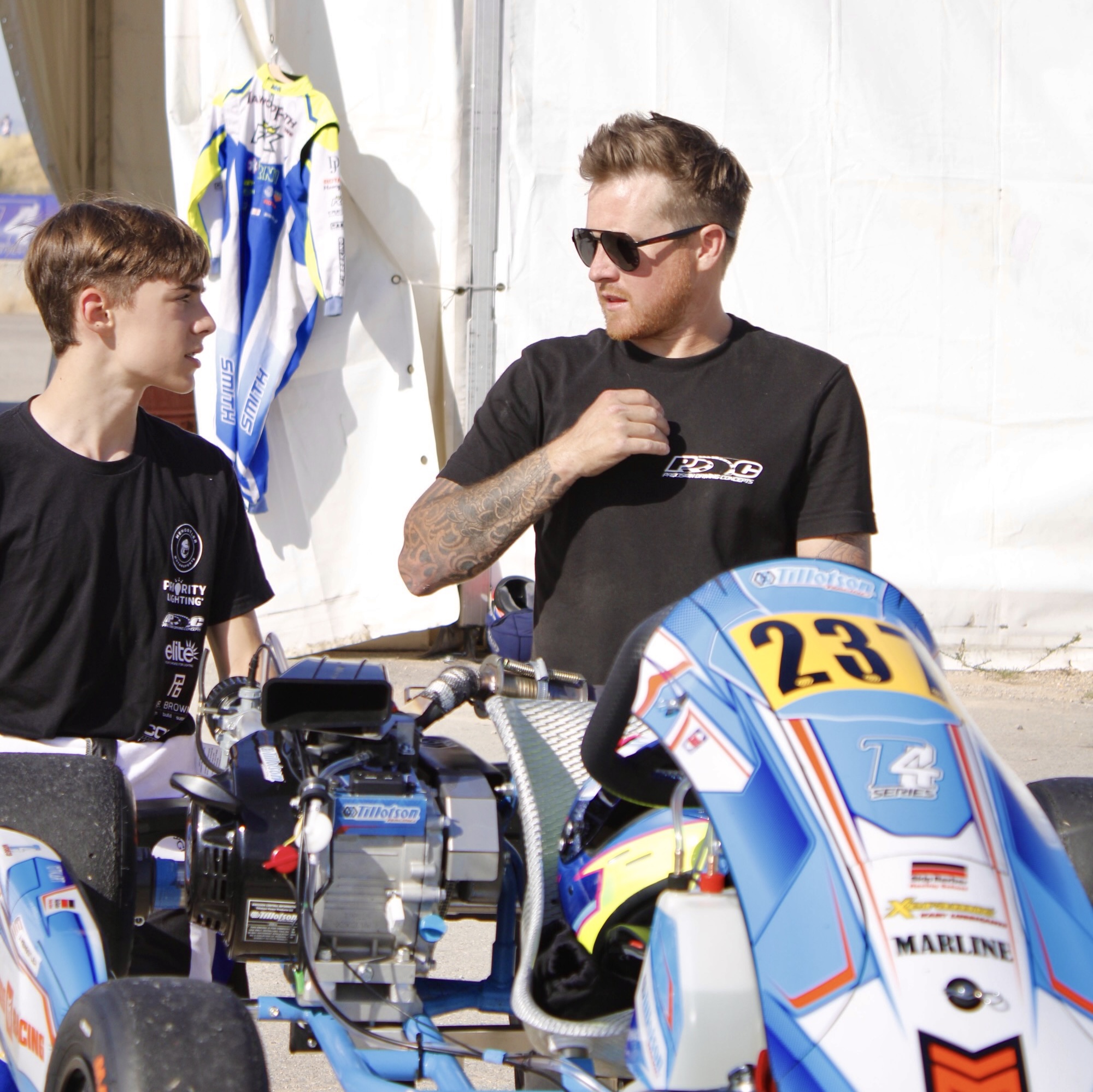 KC Cook coaching a kid on karting