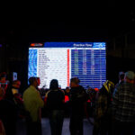Racing times on display on a giant screen at K1 Circuit in Winchester, CA